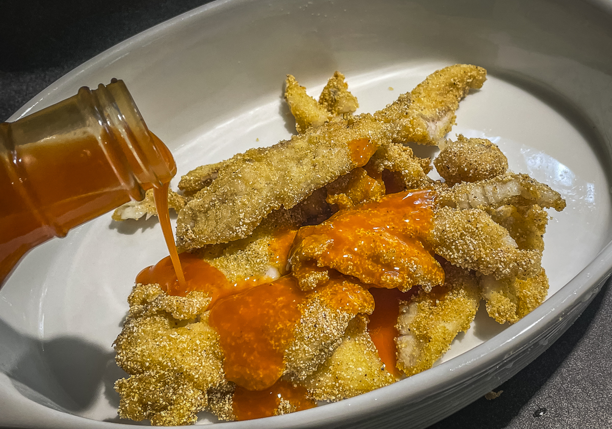 Drizzle the fish with your favorite Buffalo wing sauce.