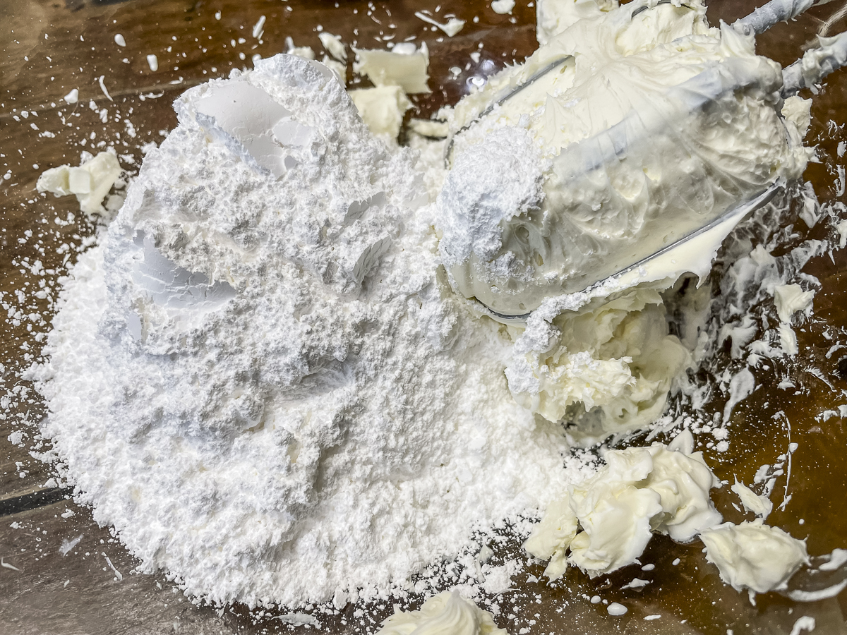 Mix the powdered sugar into the softened cream cheese.